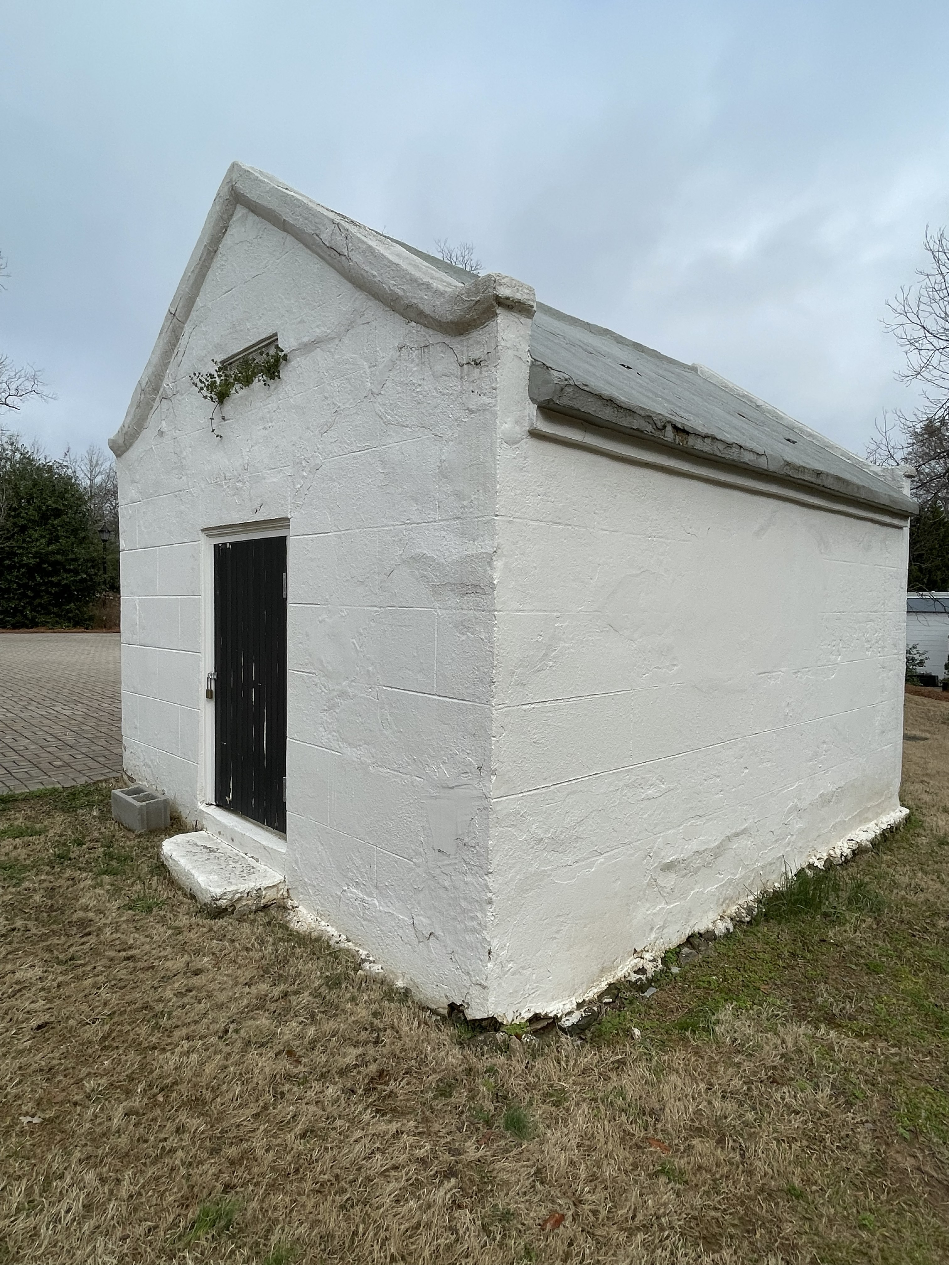 The original root cellar — a small stone structure built into the earth on the Taylor-Grady House grounds